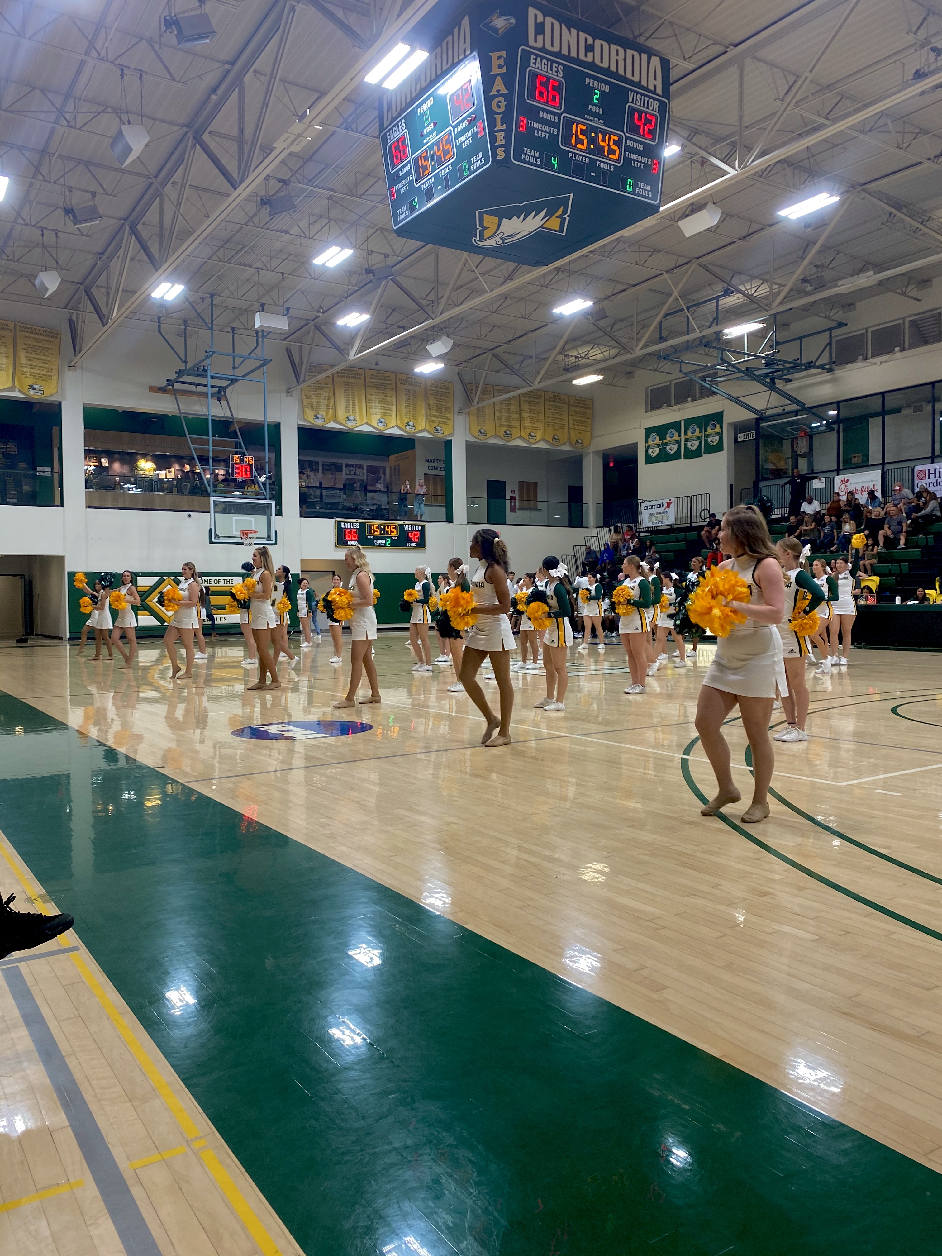 The dance team cheers on the Eagles during basketball season
